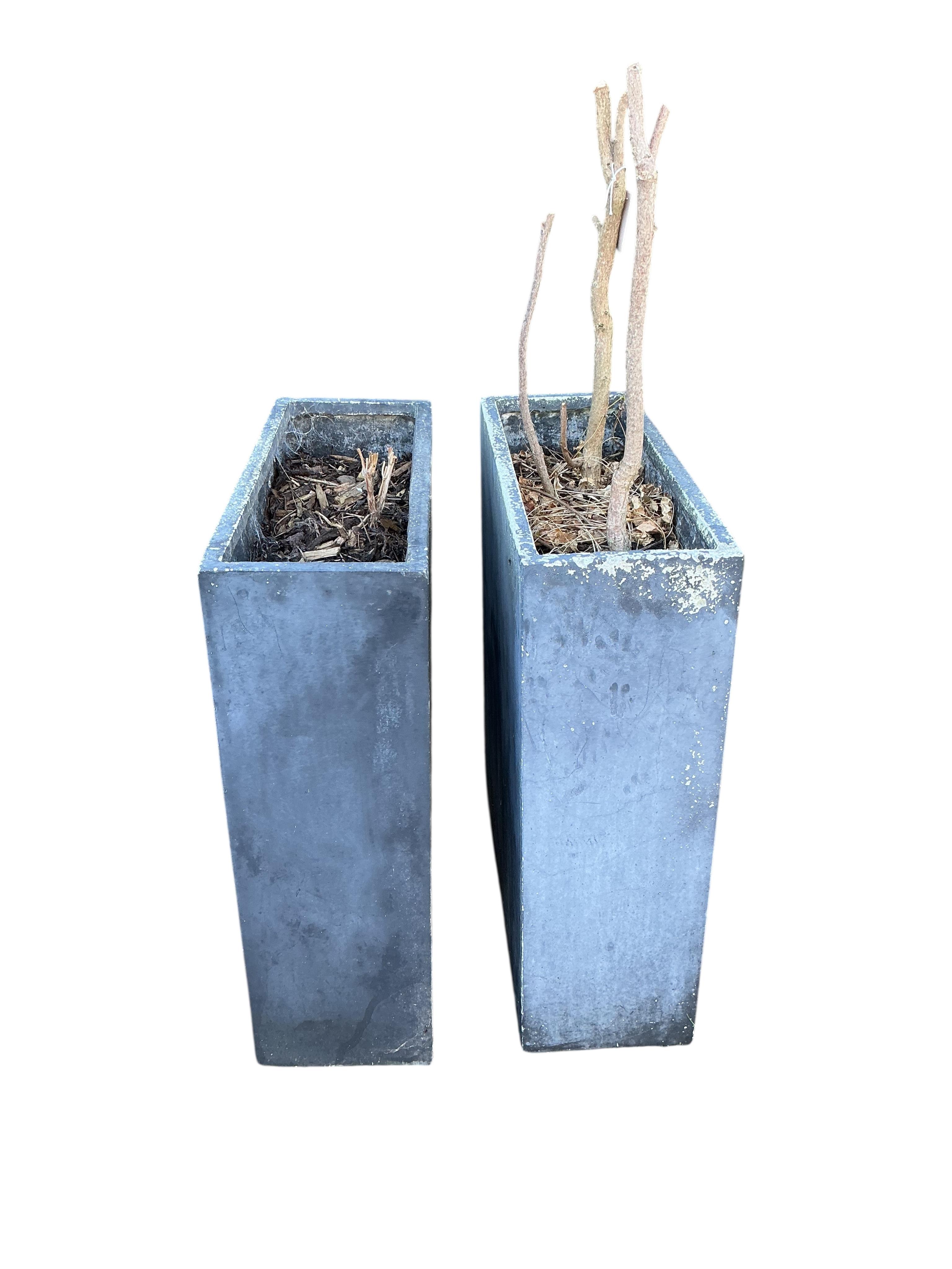 A pair of fibreglass faux lead garden planters, width 60cm, depth 23cm, height 74cm